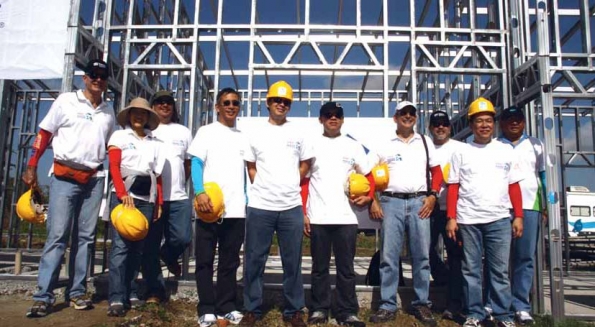 Ayala group CEOs participate in a house-building activity with Habitat for Humanity in Calauan, Laguna Ayala Group CEOs participate in Habitat for Humanity build in Calauan, Laguna
